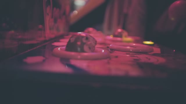 Man Plays On The Slot Machine