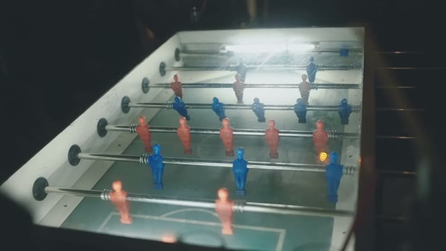 A Group Of People Playing Table Football