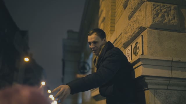 A Young Guy Communicates With A Bunch Of People On A Street In Prague