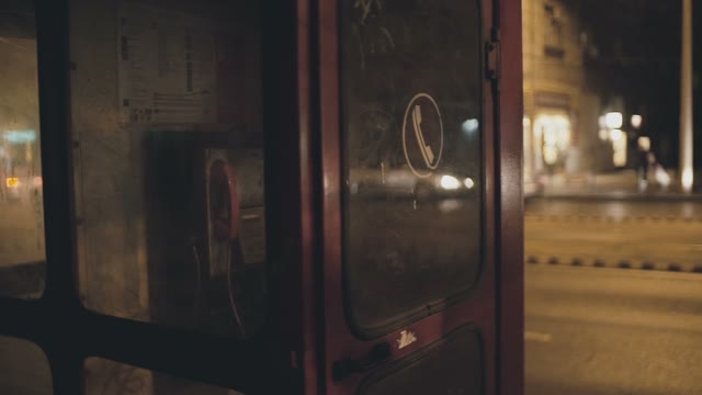 Red Telephone Box On The Night Streets Of Prague