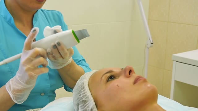 Cosmetologist Does The Face Cleaning Close-up