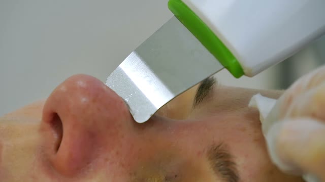 Cosmetologist Does The Nose Cleaning Close-up