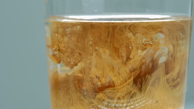 Paint In A Glass Of Water Close-up