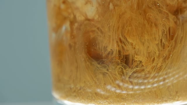 Paint In A Glass Of Water Close-up
