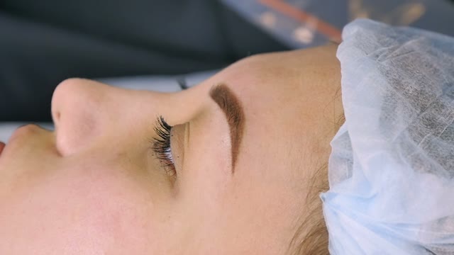 Master Wipes The Brow Of A Girl Close-up