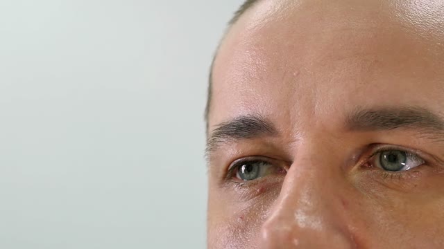 Girl Paints A Man's Eyebrow Close-up