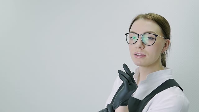 Girl Puts On Gloves Close-up