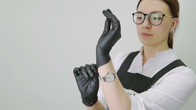 Girl Puts On Gloves Close-up