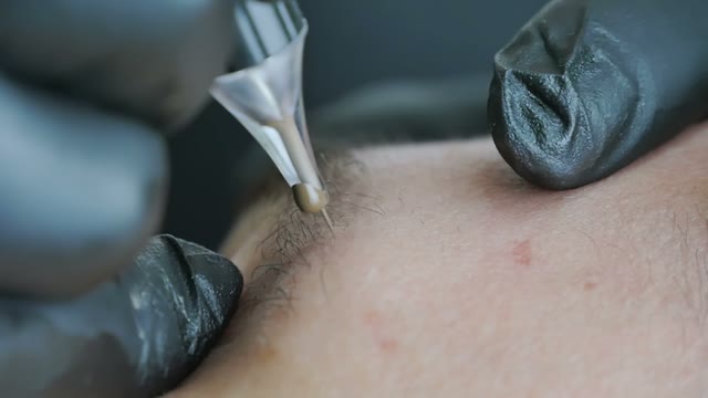 Master Does Tattoo Of Brows Close-up