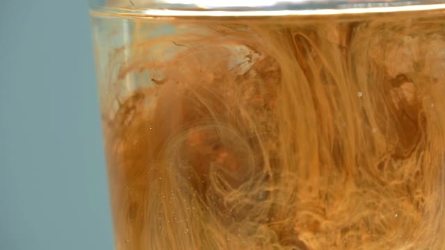 Paint In A Glass Of Water Close-up