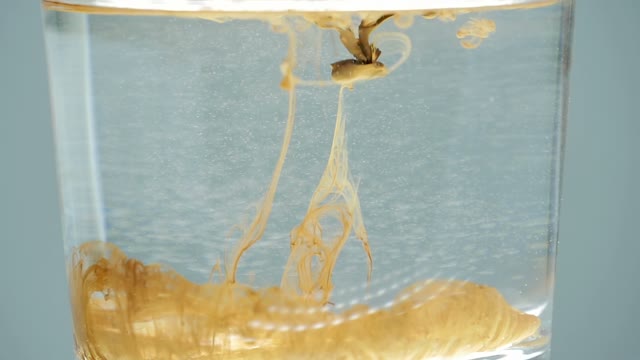 Paint In A Glass Of Water Close-up