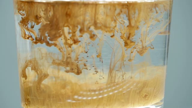 Paint In A Glass Of Water Close-up