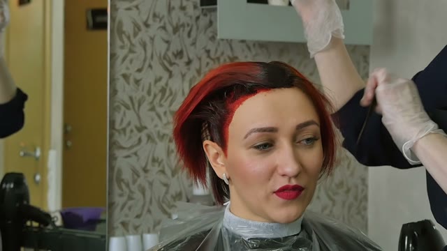 Hairdresser Colors The Client's Hair Close-up