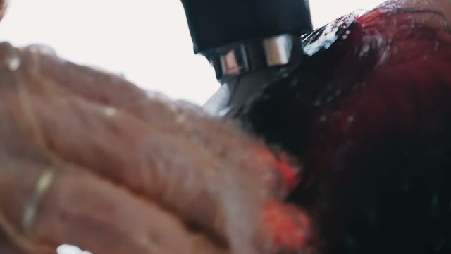 Hairdresser Washes Hair To Woman Close-up