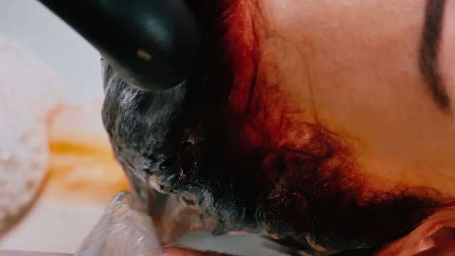 Hairdresser Washes Paint Off Hair Close-up