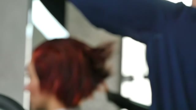 Hairdresser Dries Hair With A Hair Dryer Close-up