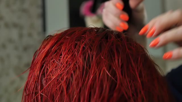 Hairdresser Dries Hair With A Hair Dryer Close-up