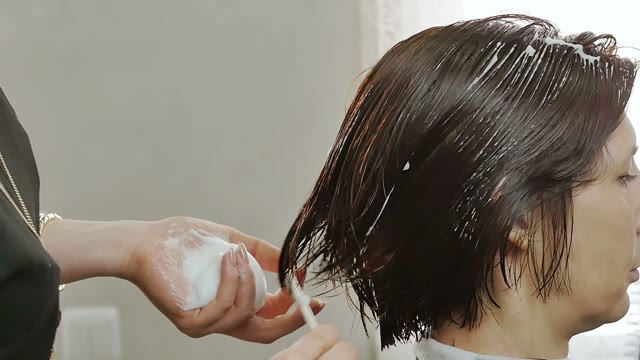 Hairdresser Makes Hair Styling Close-up
