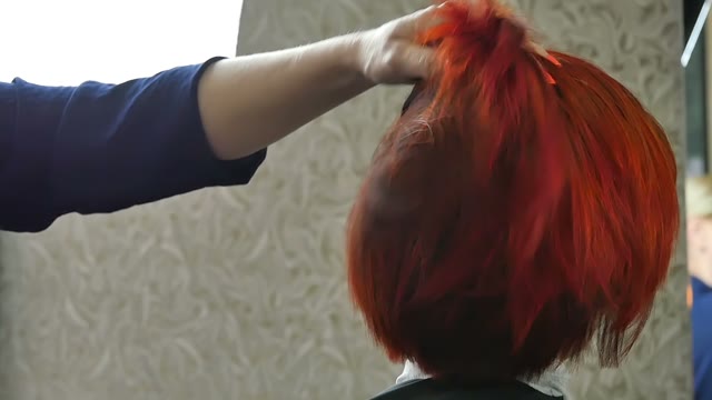 Hairdresser Sprinkles Hair Close-up