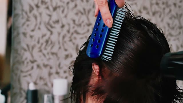 Hairdresser Makes Hair Styling Close-up