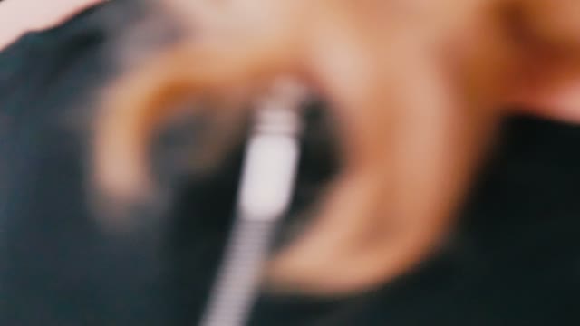 Hairdresser Cuts Hair To The Client Close-up