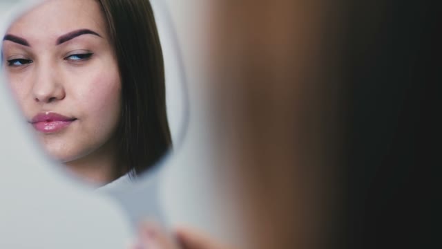 Reflection Of A Girl In The Mirror Close-up