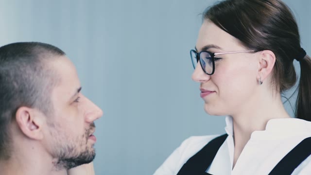 Girl Paints A Man's Eyebrow Close-up