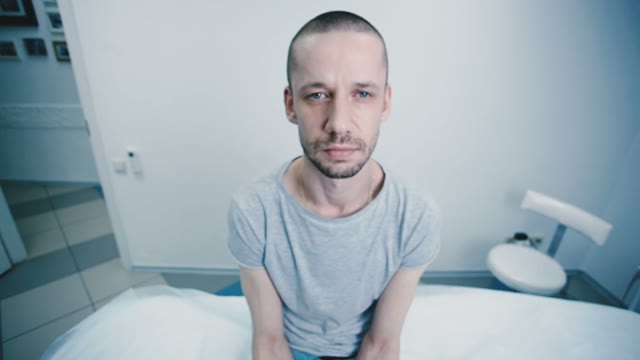 Man Sitting On A Hospital Bed Close-up