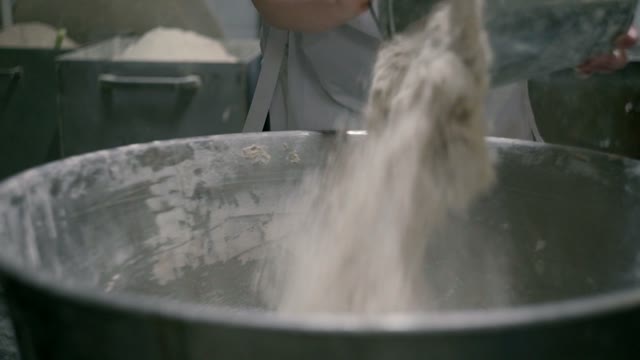 Woman Pours Flour