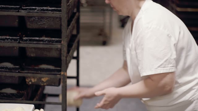Woman Puts The Dough In Molds