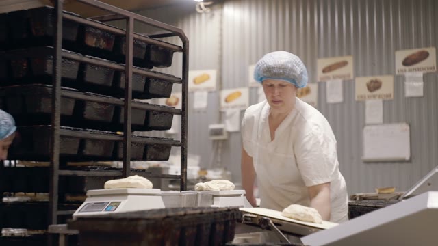 Women Put The Dough In The Molds