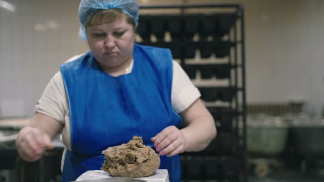 Woman Measures The Portion Of The Dough