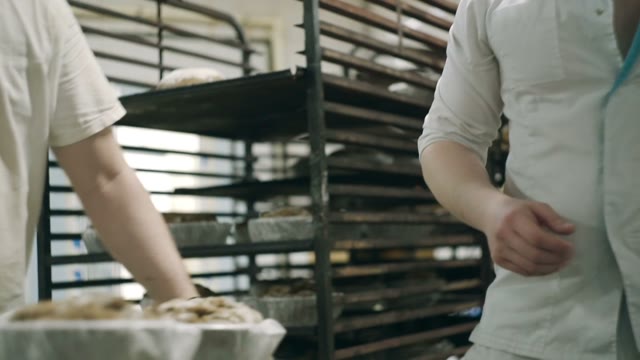 Men Spread Bread From Molds