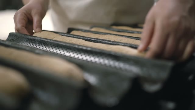 Woman Spreads Dough