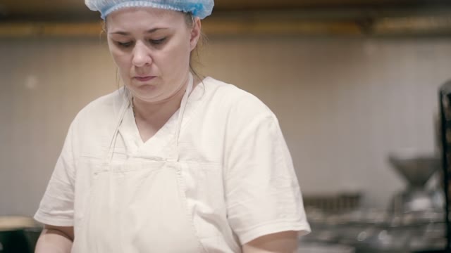 Woman Kneads Dough