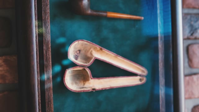 Smoking Pipe Hangs On The Wall
