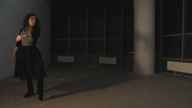 Woman Dancing In Dark Hall