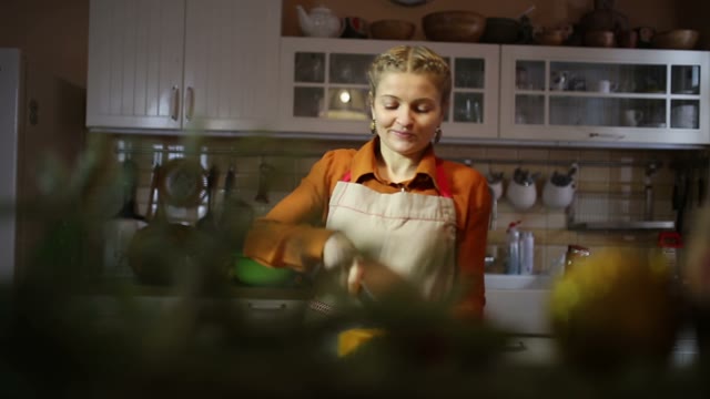 Housewife Cuts Pumpkin And Smiles