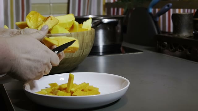 Woman Slices A Pumpkin