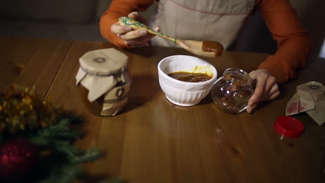 Woman Puts Honey From The Bowl