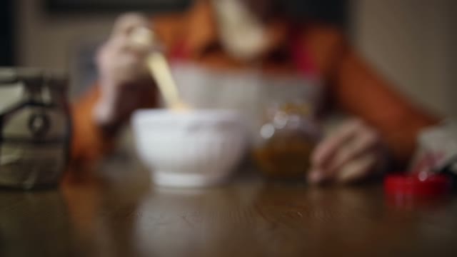 White Cup And Jar Of Honey Close Up