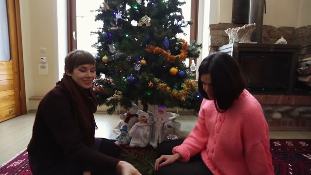 Two Girls Pack A New Year Gift