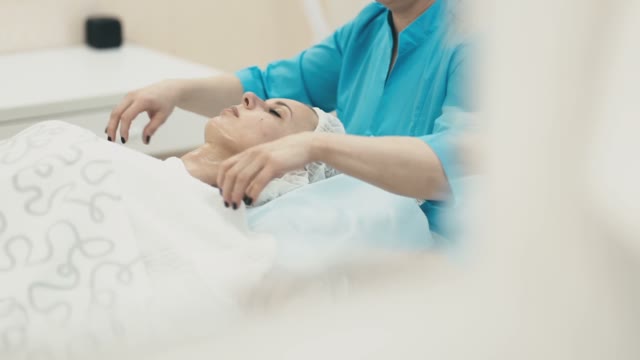 Woman Performs Spa Treatments For A Young Girl