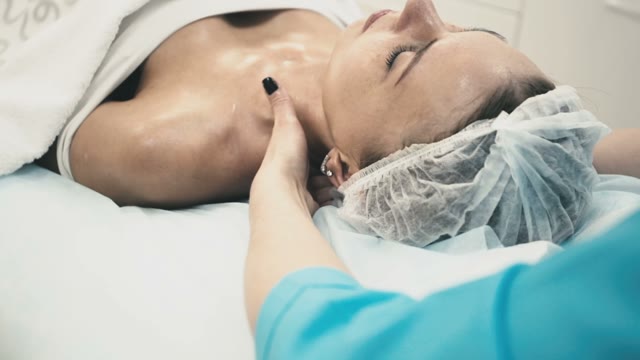 Employee Of The Spa Salon Makes A Healthy Neck Massage For A Young Beautiful