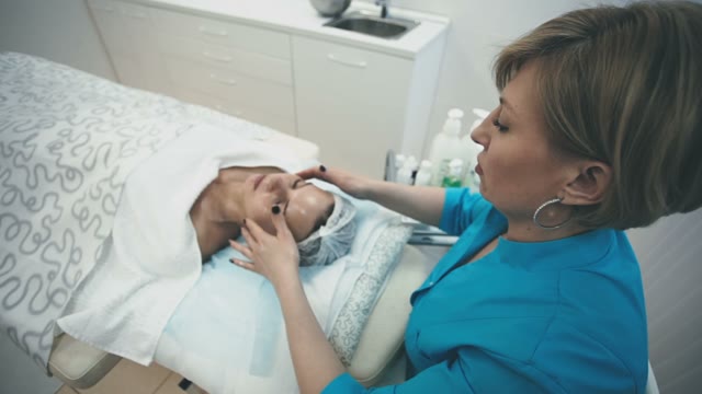 Unusual Massage Of The Face Of The Employee Of The Spa Salon