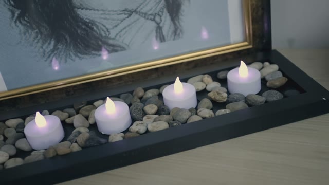 Candles Burning Next To The Picture