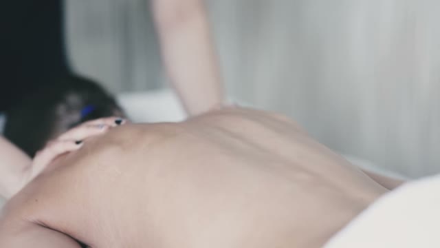 The Masseuse Does A Back Massage