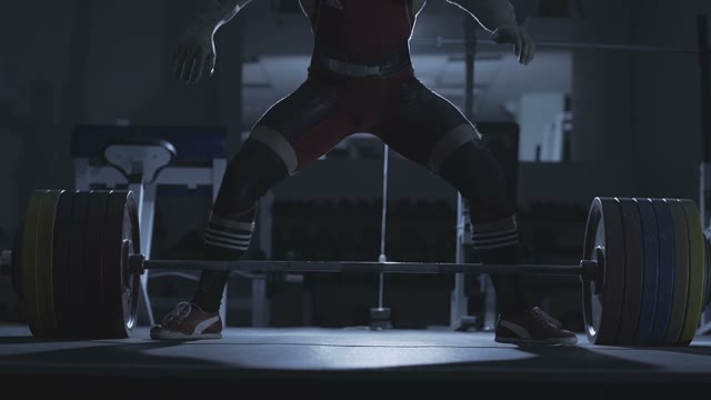 Man Takes Barbell