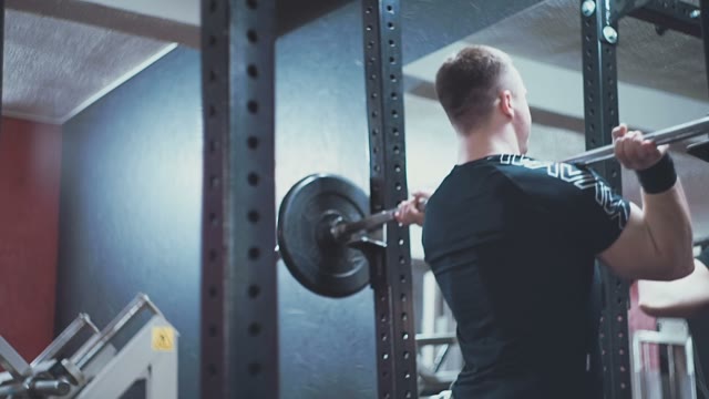 Man Doing An Exercise With A Barbell