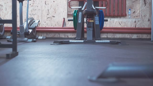 Man Is Walking Along The Gym